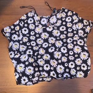 Cute Daisy crop top with peekaboo back detail.
